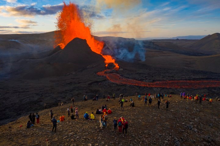 hundred of hikers looking at  Eldfjallaferðir, volcano