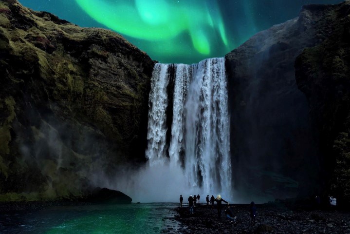 Skógafoss with northern lights in the sky