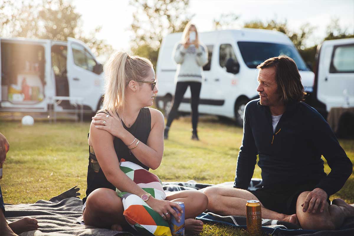 woman and a man talking in a campsite in iceland