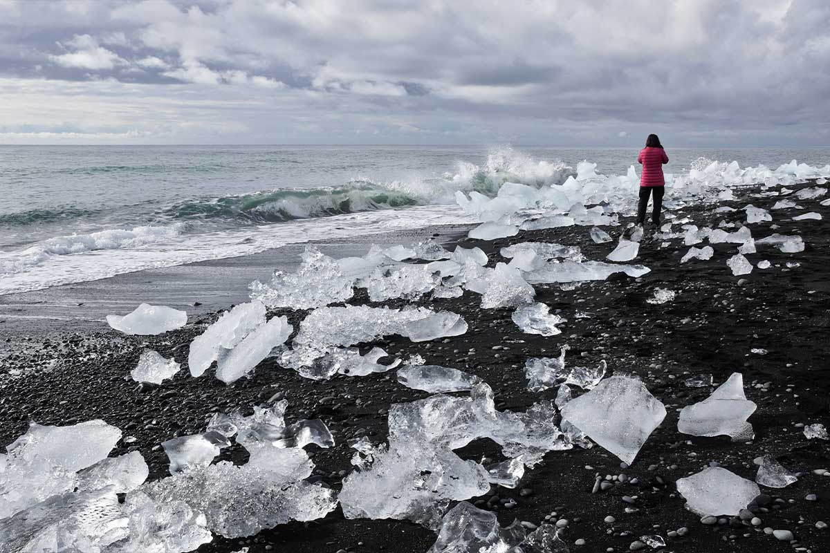 Glacial ice washed up on the black sand beach at the mouth of the Jokulsa River, Jokulsarlon, southern Iceland