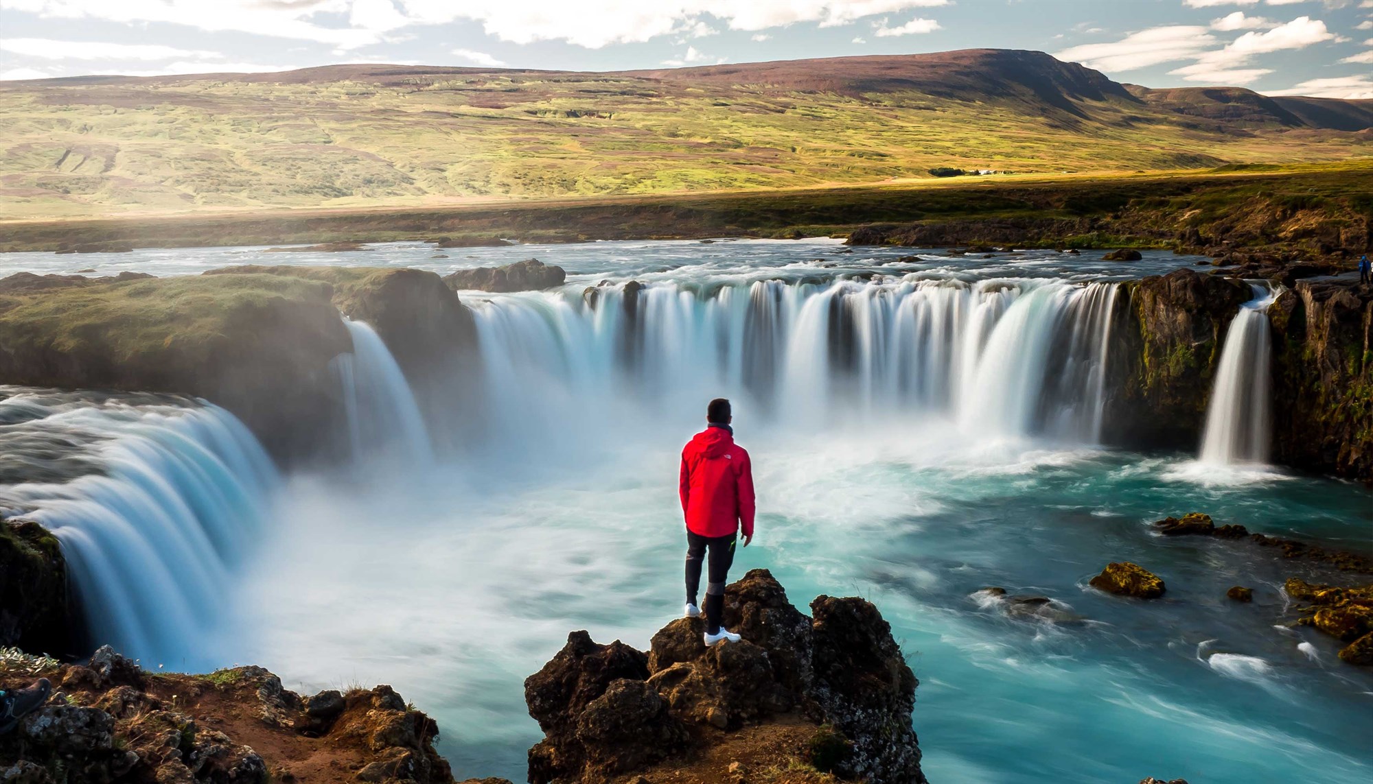 Godafoss in Iceland, man standing in front