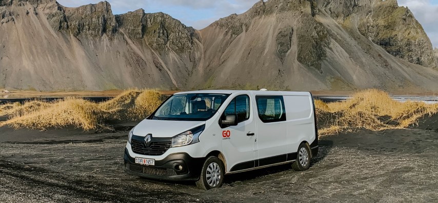 campervan in Iceland in front of mountains