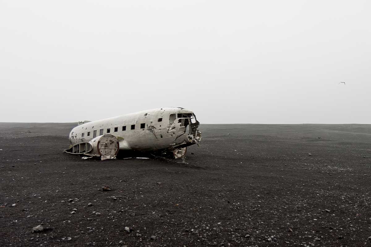 DC-D Mcdonnell Douglas solheimasandur plane wreck on black sand beach lonely flying bird